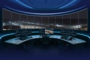 working positions in a tower with view into the runway during night time