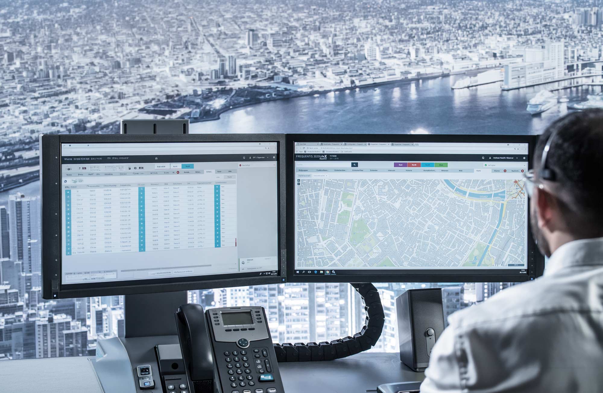 LifeX header picture, showing two screens, devices, a person operating, and the city in the background