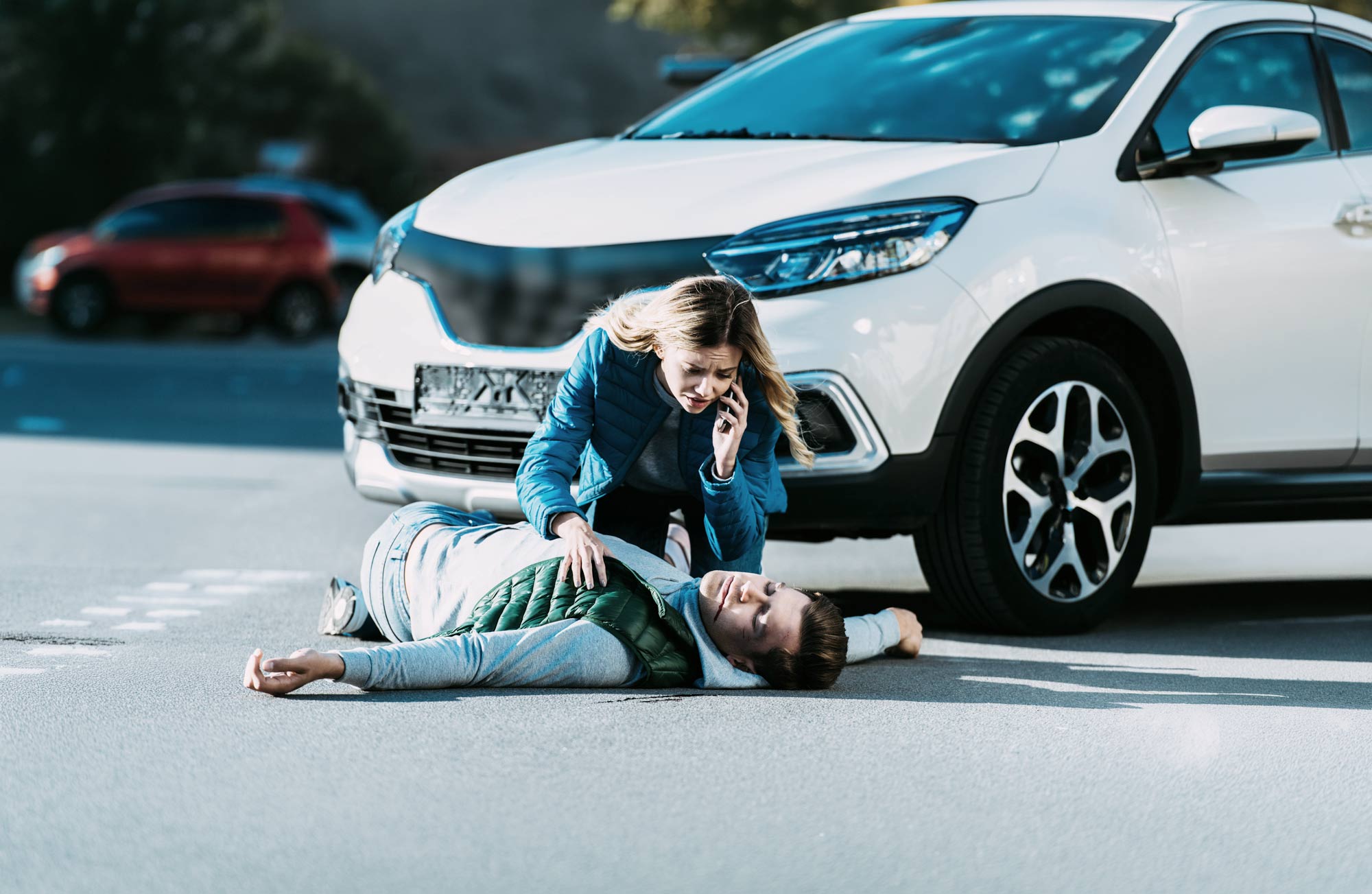 FlagMii EML header picture, showing an accident, a male person lying on the street and a female person calling an ambulance