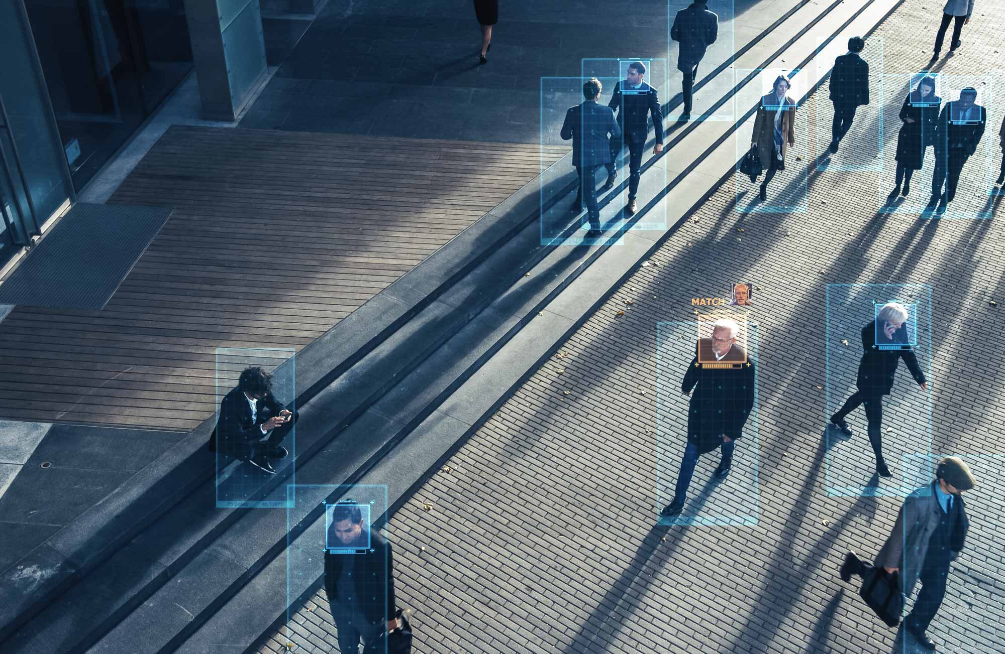 Alerting header picture, showing people walking on a street, one is marked for a match with a certain picture