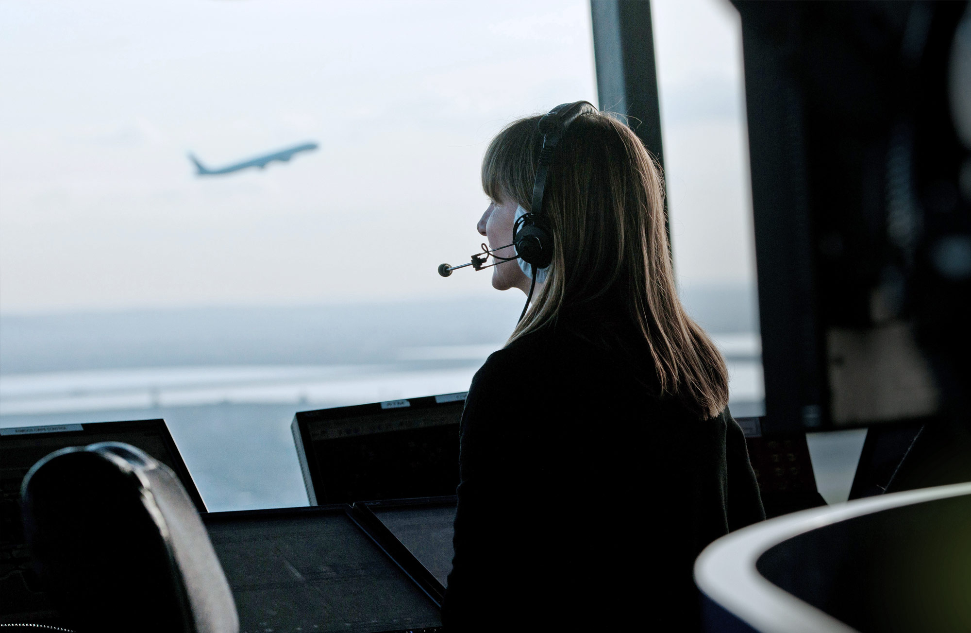 Integrated Arrival Departure Manager (IAD) header picture, showing a woman operating 