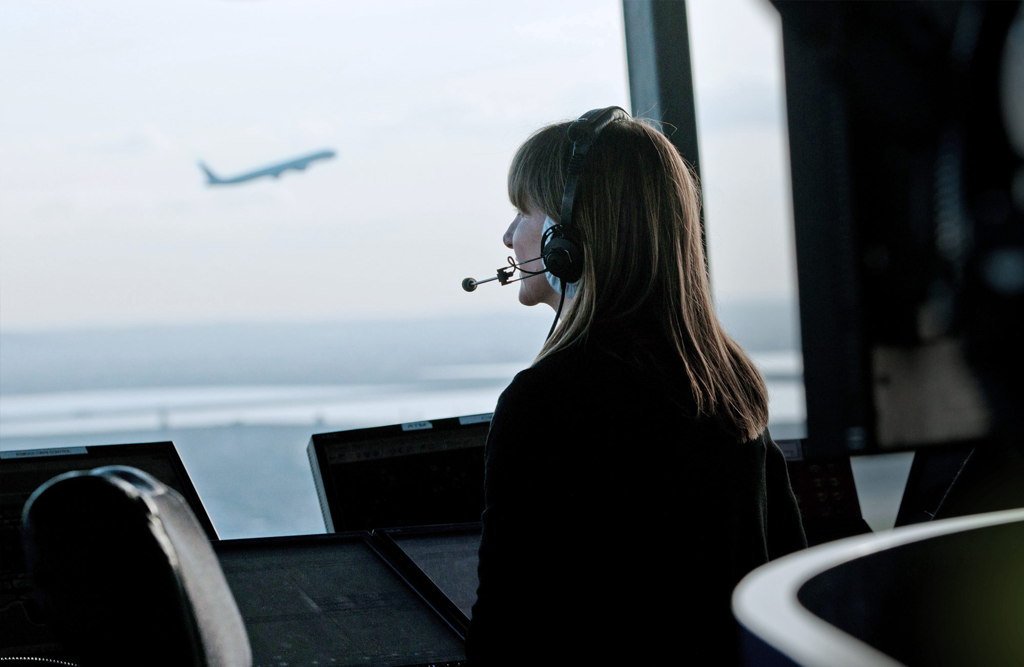Integrated Arrival Departure Manager (IAD) header picture, showing a woman operating