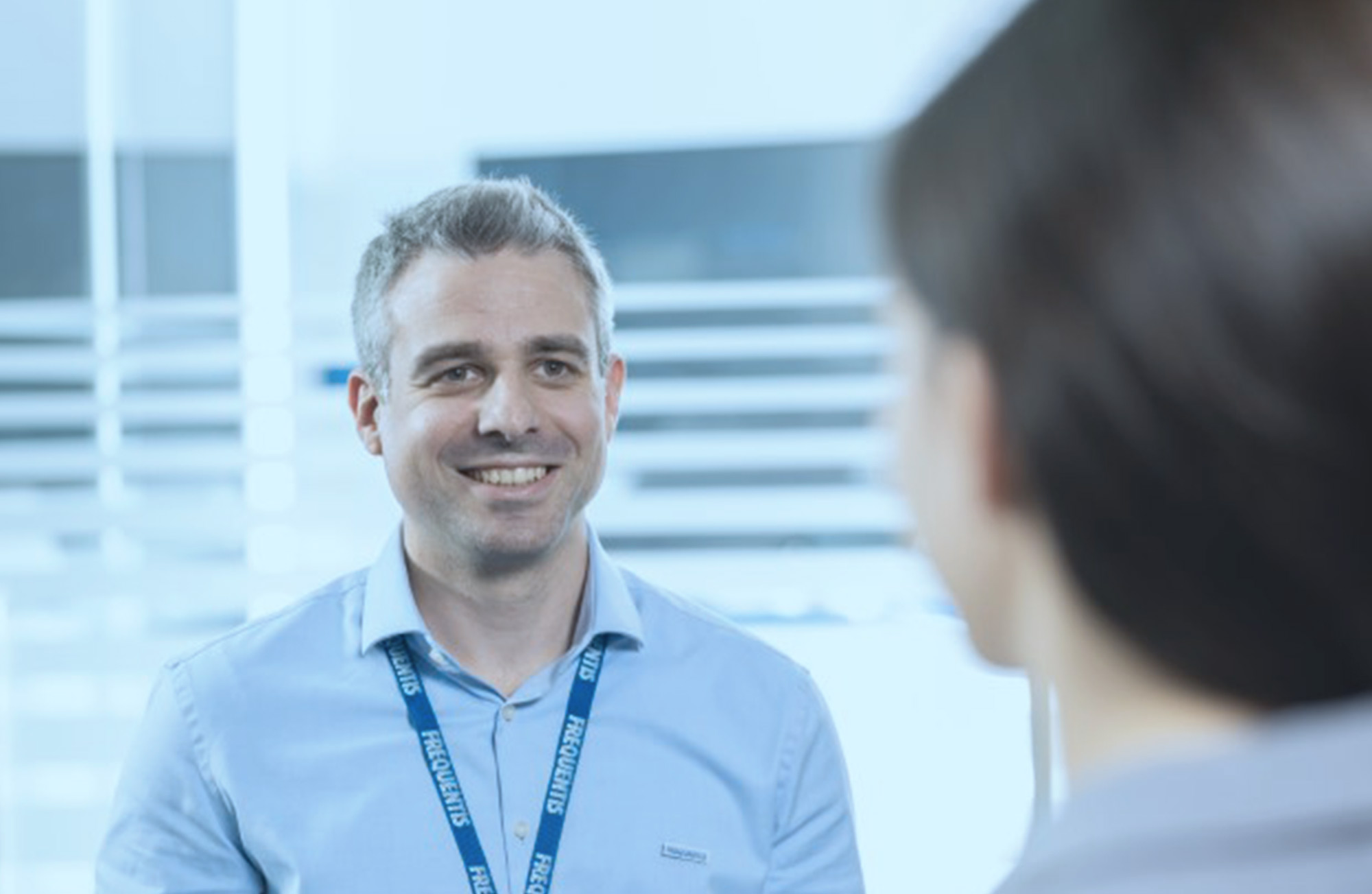 Public Transport Life-cycle Management header picture, showing a Frequentis employee