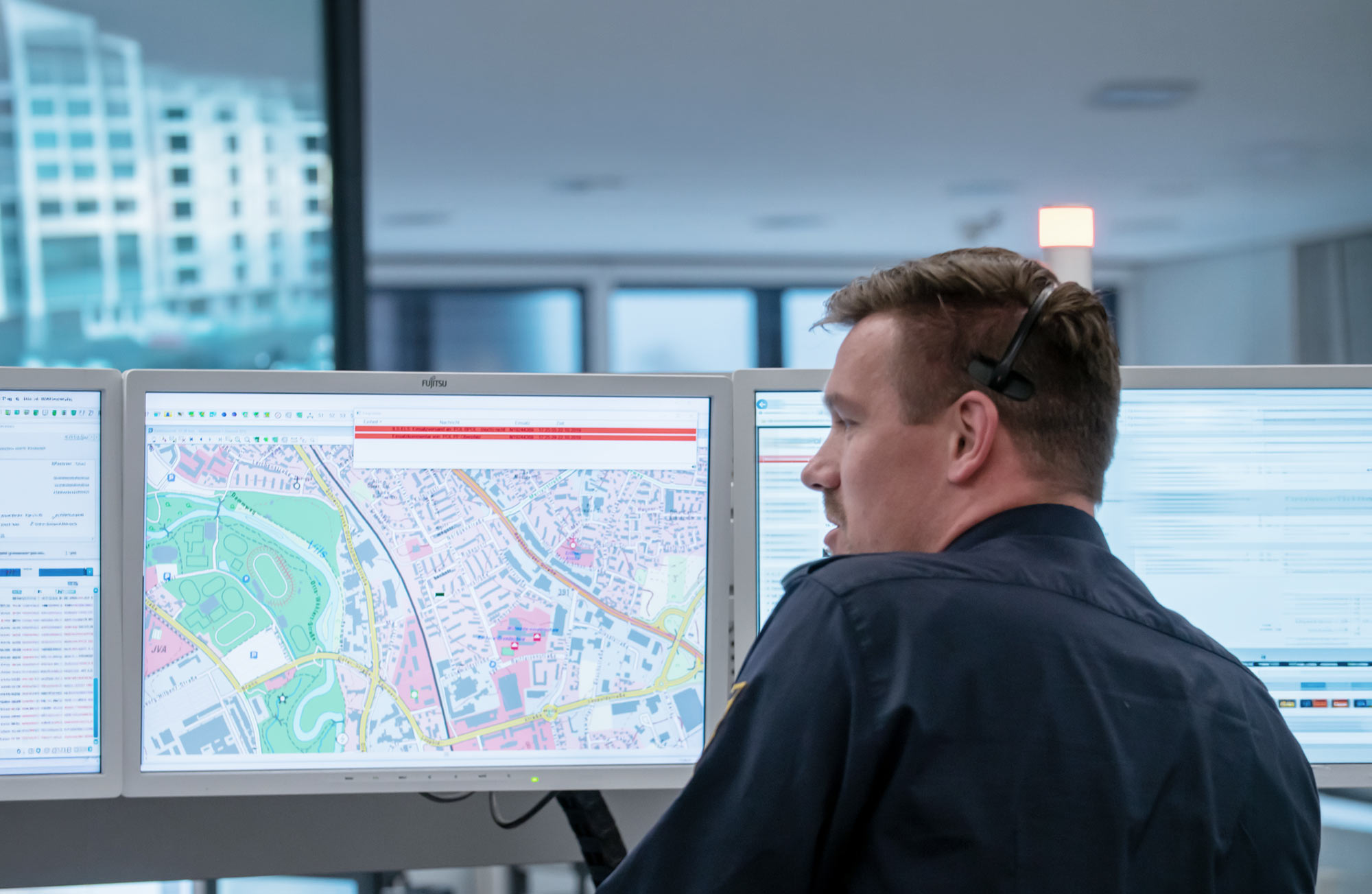 Public Safety Products & Solutions header image, showing a person in a control room