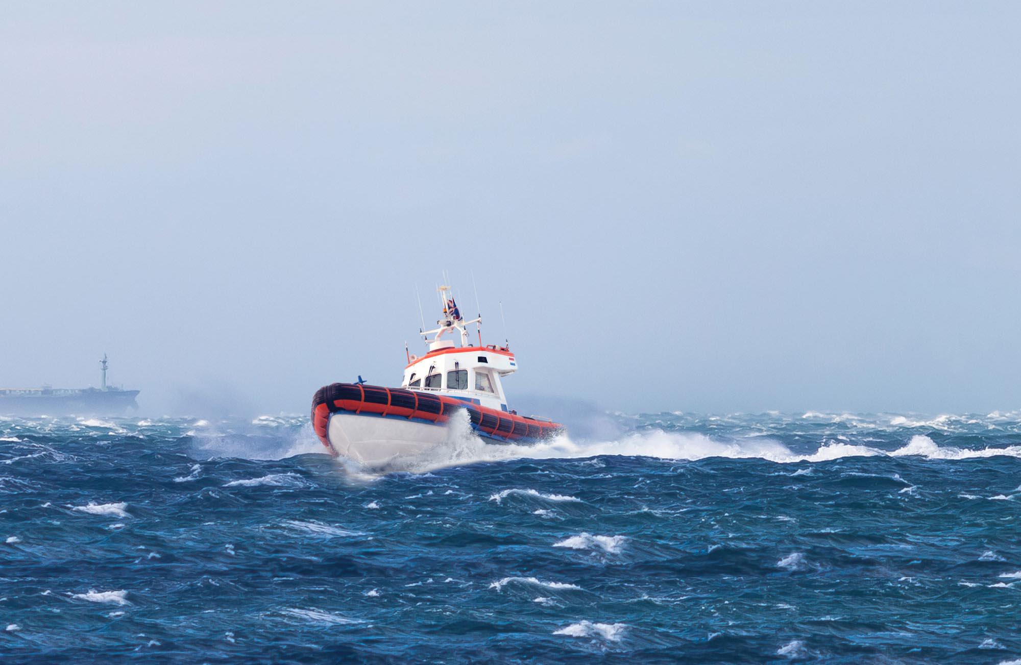 Maritime header picture, showing a ship at the stormy sea