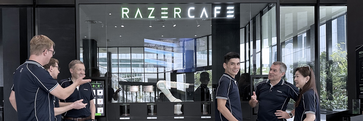 razer cafe at the Singapore office site, showing the team in front of a robotic barista