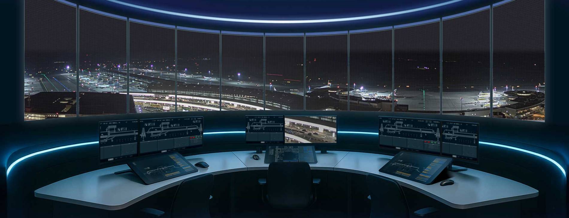 working positions in a tower with view into the runway during night time