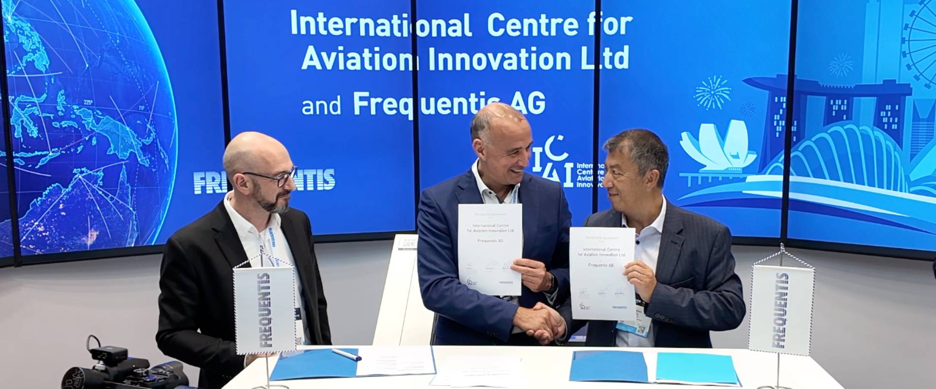 Reinhard Grimm, Norbert Haslacher and Patrick Ky shaking hands