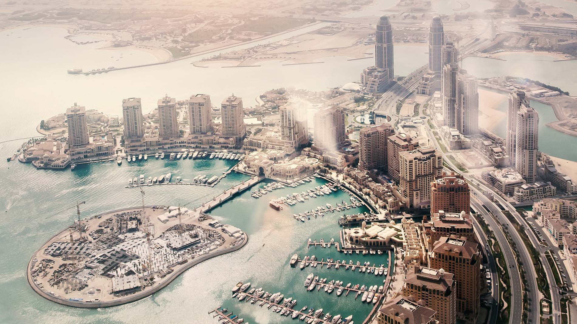 Doha, the capital of the state of Qatar. View from the airplane; AdobeStock_259807594